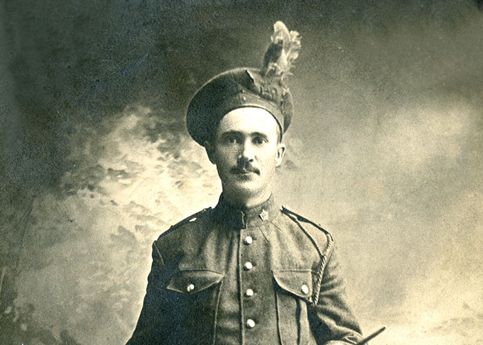 Sepia portrait of a soldier in uniform.