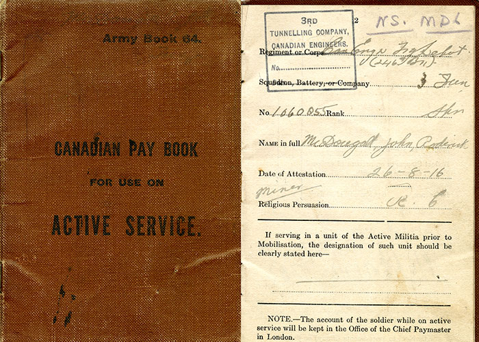 Composite image of J.R. McDougall's military service paybook. The brown cover is at left and the inside page with identifying information about the soldier is at right.